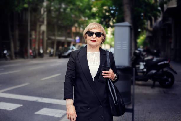 istock Senior woman with sunglasses 1003589974