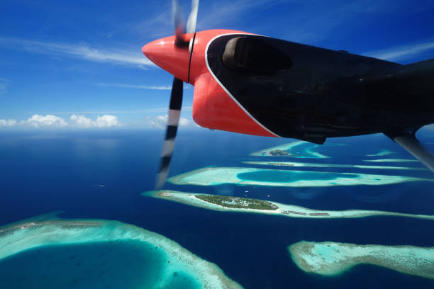 istock Group of atolls in Maldive on a Seaplane 1003593174