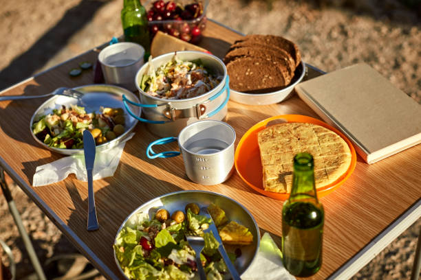istock Various foods and drinks arranged on picnic table 1003593186