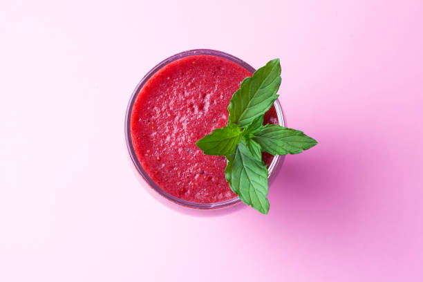 Delicious strawberry Smoothie Delicious strawberry Smoothie on pink background blended drink photos stock pictures, royalty-free photos & images