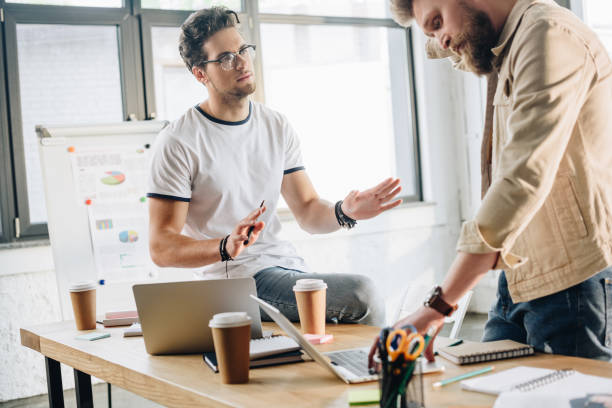 istock Professional business male colleagues in modern office 1003598828