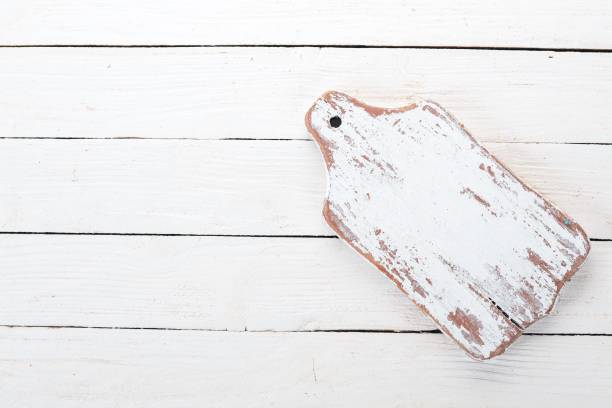 istock Old Wooden kitchen white board. Wooden background. Top view. Free space for your text. 1003603078