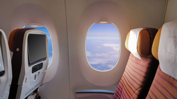 istock Closeup the window of the passenger plane 1003609494