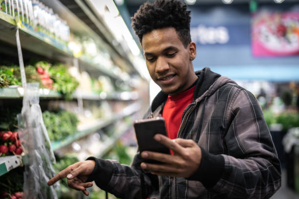 istock Customer Buying with mobile app on Supermarket 1003610736