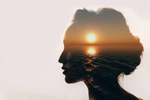 Psychology concept. Sunrise and woman silhouette. Psychology concept. Sunrise and woman silhouette. silhouette lounge stock pictures, royalty-free photos & images