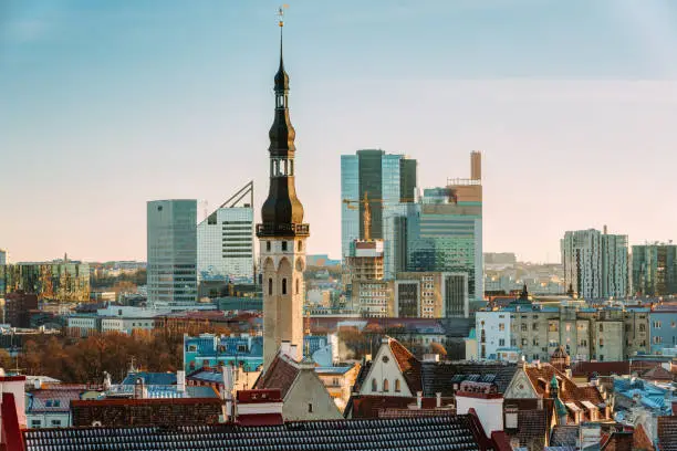 Photo of Tallinn, Estonia. View Of Tower Of Tallinn Town Hall On Background Of Modern Architecture. Oldest Town Hall In Baltic Region And Scandinavia