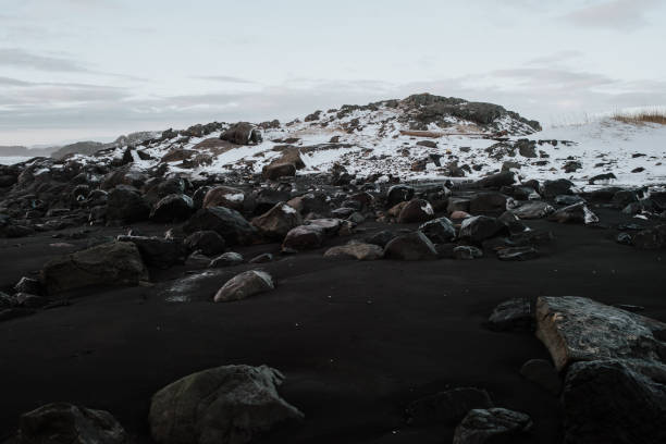 istock Rocky black sand beach in Stokksnes, Iceland 1003618004
