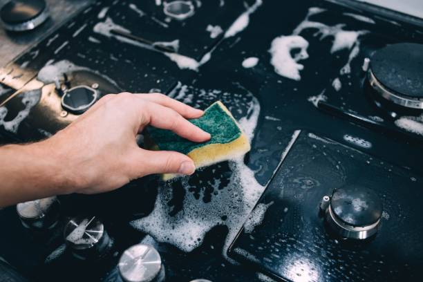 istock cleaning plate gas, glass ceramic surface. burner 1003624706