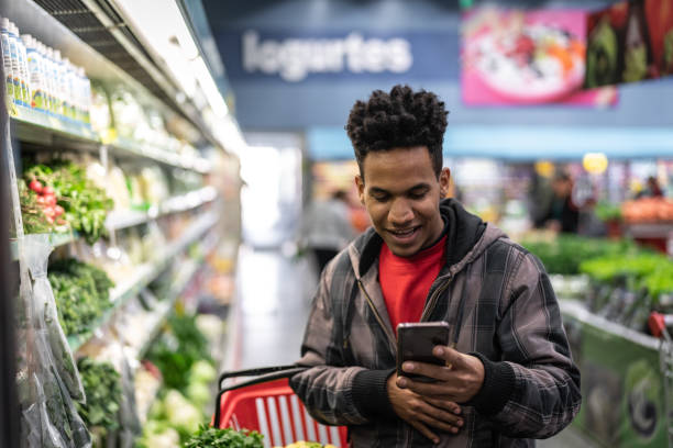 istock Customer Buying with mobile app on Supermarket 1003627460