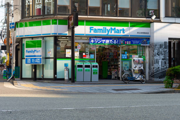 FamilyMart (one word) convenience store is the third largest in 24 hour convenient shop market Osaka, JAPAN - CIRCA June, 2018:FamilyMart (one word) convenience store is the third largest in 24 hour convenient shop market, after Seven Eleven and Lawson. Franchise In Malaysia stock pictures, royalty-free photos & images