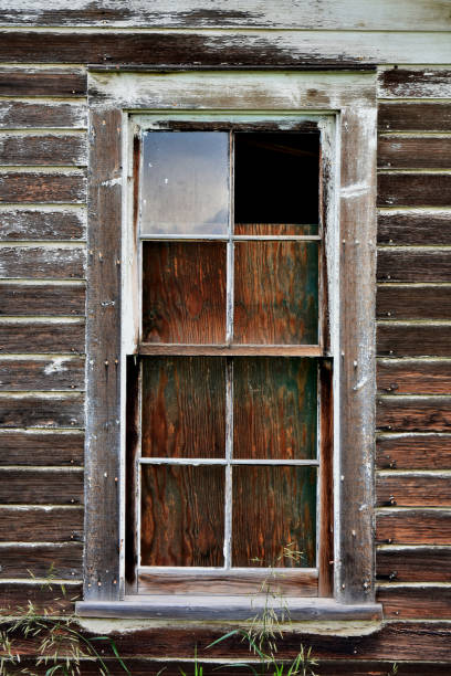 istock Old Weathered and Broken Wooden Window 1003648144