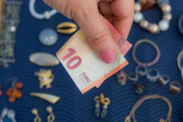 istock Woman buys earrings on flea market 1003648790