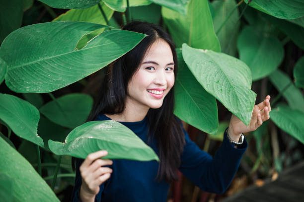 istock Smile asian woman in forest 1003651690