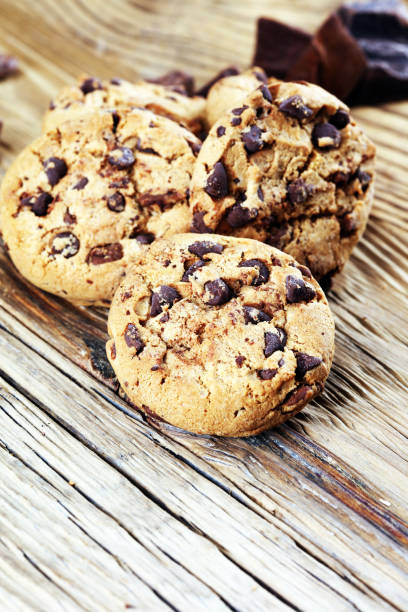 istock Chocolate cookies on table. Chocolate chip cookies shot with chocolate 1003655596