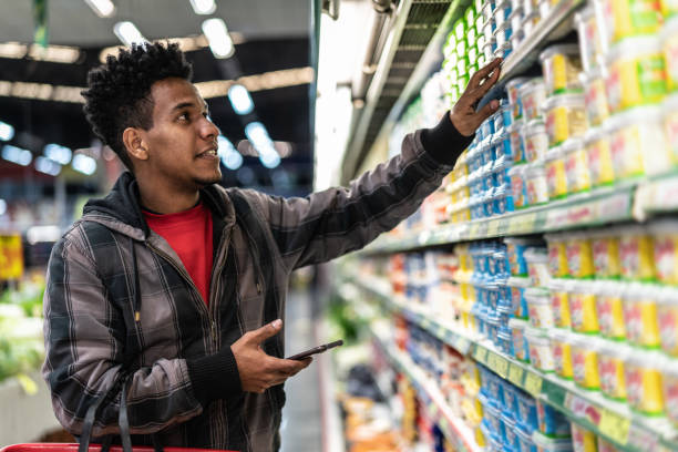 istock Customer Buying with mobile app on Supermarket 1003655994