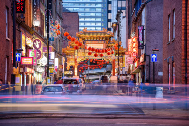 China Town Manchester China Town gate with green and golden decoration and painted panels at Manchester city center, one of the lagest in the UK and Europe. chinatown photos stock pictures, royalty-free photos & images