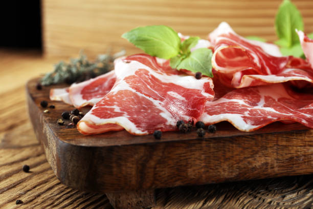 istock Italian sliced cured coppa with spices. Raw ham. Crudo or jamon 1003678842