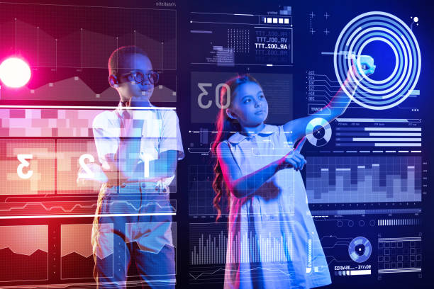 istock Thoughtful boy looking at the screen while a girl touching it 1003697510