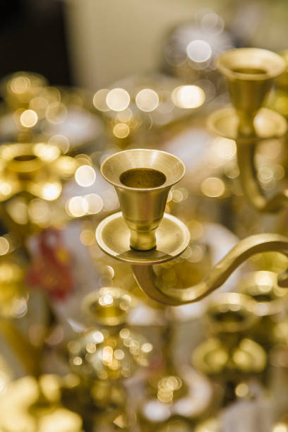istock Golden candlestick closeup, the background is blurred 1003720534