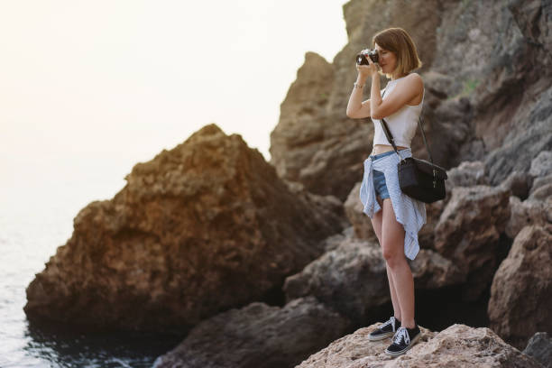 istock Young woman taking a picture 1003736178