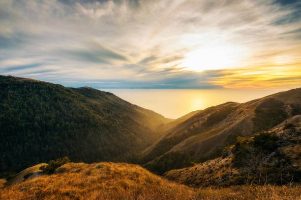 Sunset over the pacific ocean from Santa Lucia Range Sunset over the Pacific Ocean seen from the Nacimiento-Fergusson road  through the Santa Lucia Range  in California seascape stock pictures, royalty-free photos & images