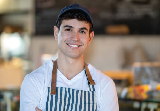 istock Happy waiter working at a restaurant 1003743736
