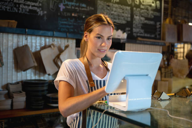 istock Woman working at a restaurant placing an orden in the computer 1003743776