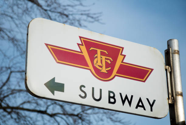 TTC Subway Sign Toronto, Canada - March 17, 2017: TTC Subway sign outside Old Mill station rusty pole stock pictures, royalty-free photos & images