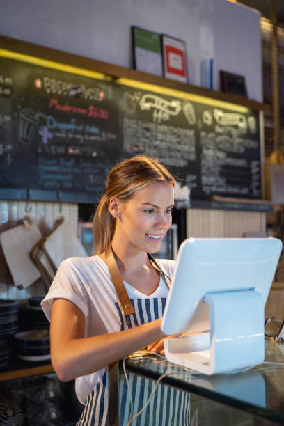 istock Happy manager working at a restaurant placing order on the computer 1003743852