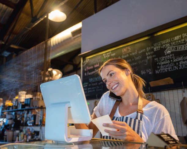 istock Waitress at a restaurant taking a delivery order 1003743960