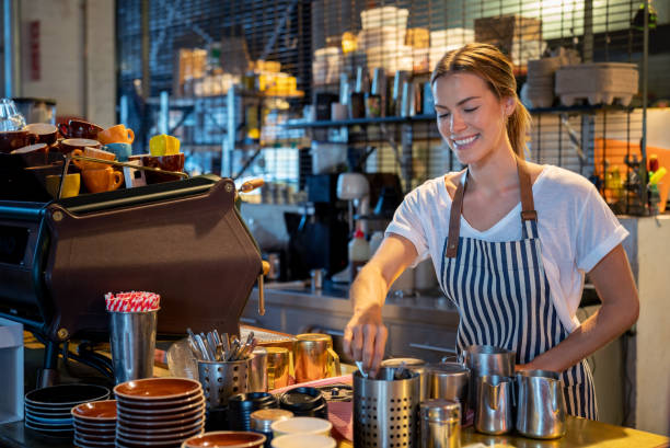 istock Happy barista making coffee at a cafe 1003743976