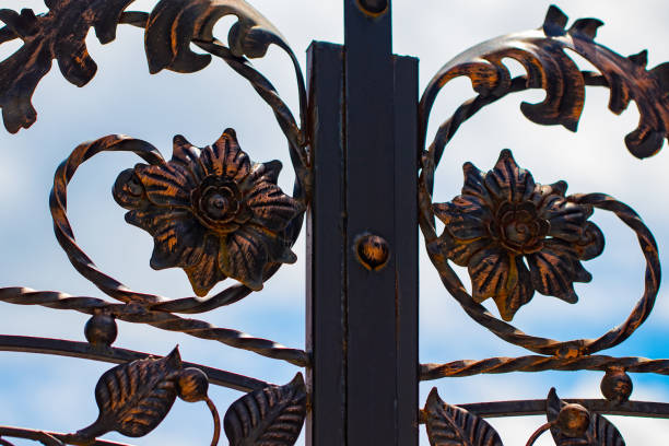 istock ornate wrought-iron elements of metal gate decoration 1003746978