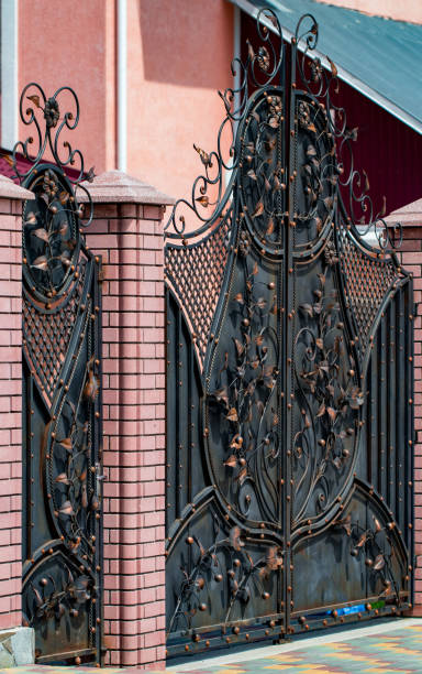 istock ornate wrought-iron elements of metal gate decoration 1003747012