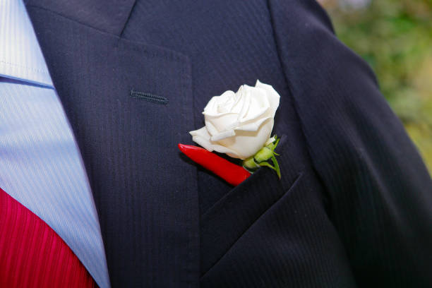 istock Groom in elegant tuxedo with boutonniere 1003747616