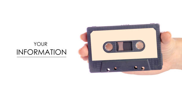 istock Audio cassette in hand stereo music pattern 1003750892