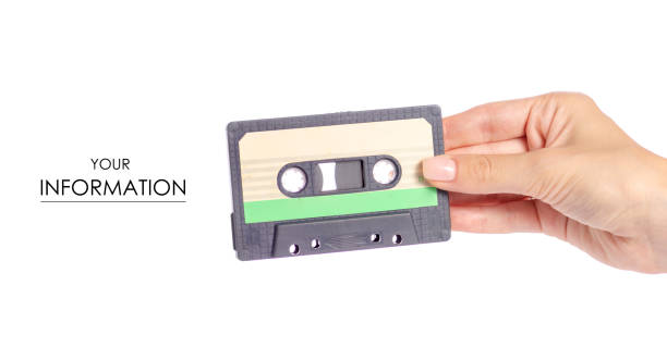istock Audio cassette in hand stereo music pattern 1003750898