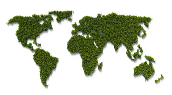 World geographical border made of green grass on white background. Horizontal composition with clipping path and copy space. Climate Change And Green Energy Concept