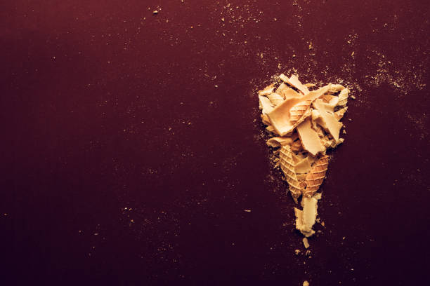 istock Crushed ice cream cone on dark brown background 1003762222