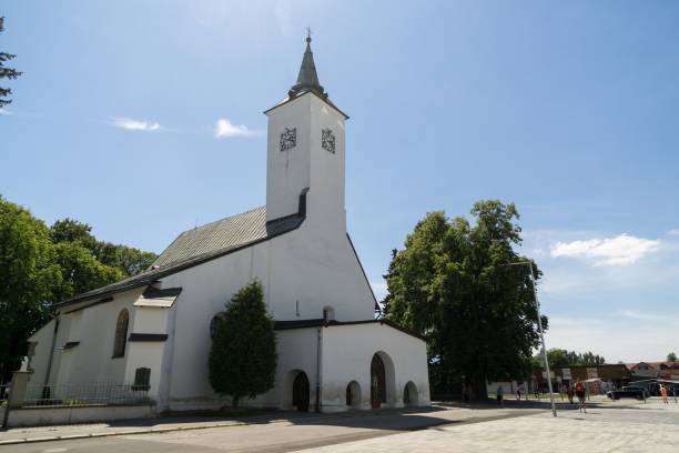 istock Building, Church and town during sunny day with clouds on sky. 1003763008