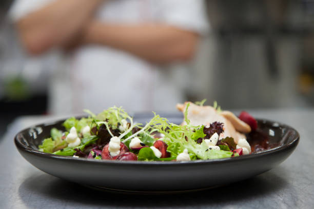 istock The cook prepares a salad with cherries 1003763556