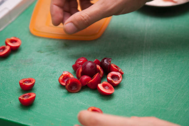 istock The cook prepares a salad with cherries 1003763588