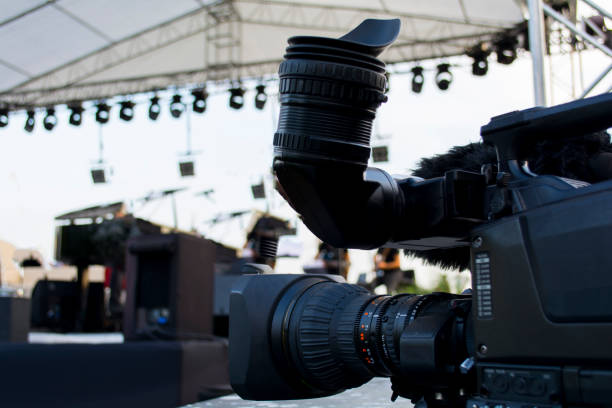 istock Professional digital video camera. accessories for 4k video cameras. tv camera in a concert hall. 1003768340