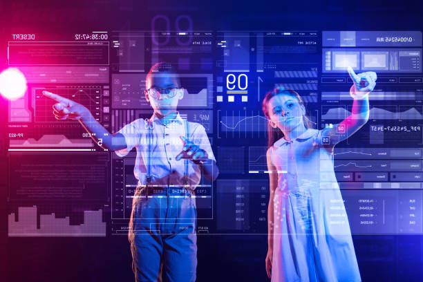 istock Serious children touching a transparent screen and looking calm 1003772038