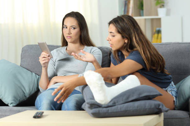 istock Angry woman ignoring her disabled roommate 1003787214
