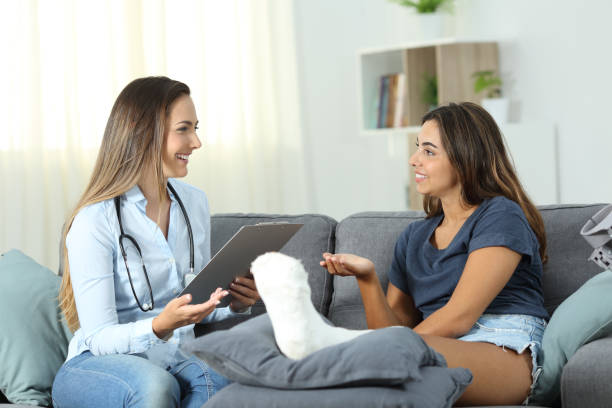 istock Doctor and patient talking at home 1003789924
