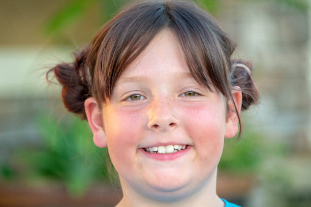 Smiling caucasian little girl looking at the camera
