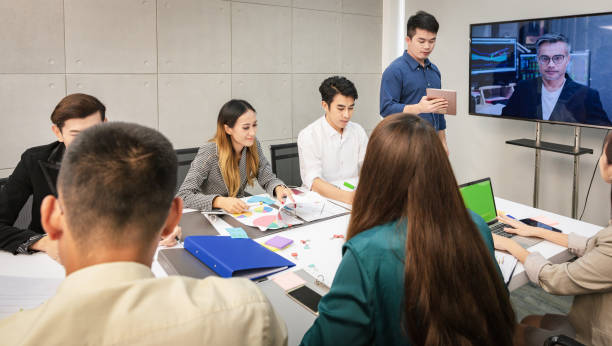 istock Video conference with CEO, meeting presenting project to a group of managers teamwork 1003801638