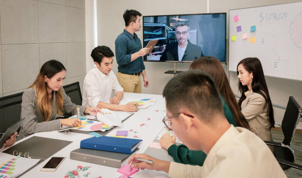 istock Video conference with CEO, meeting presenting project to a group of managers teamwork 1003801656