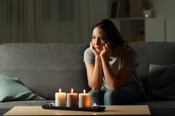 istock Frustrated woman sitting at home during a blackout 1003816590
