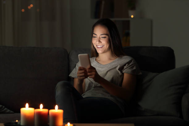 istock Girl writing messages on a phone in the night 1003817020